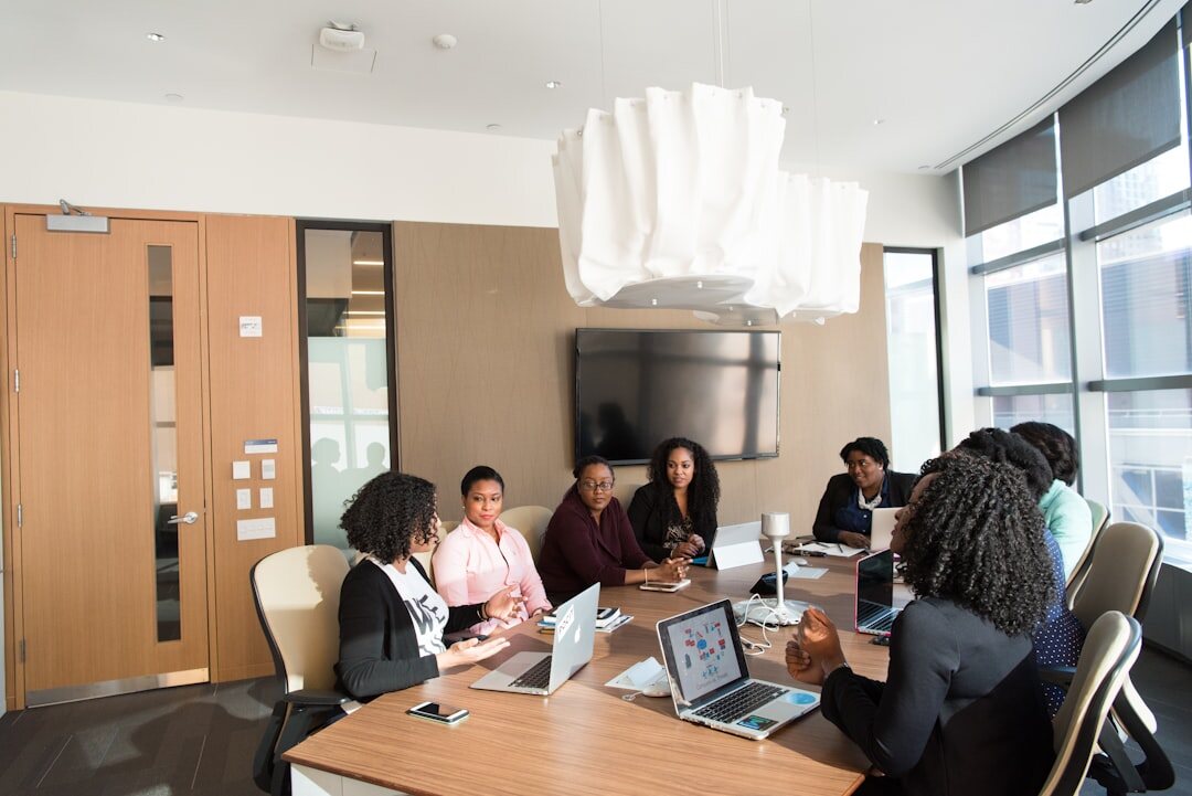 Team collaborating around a table in a meeting room