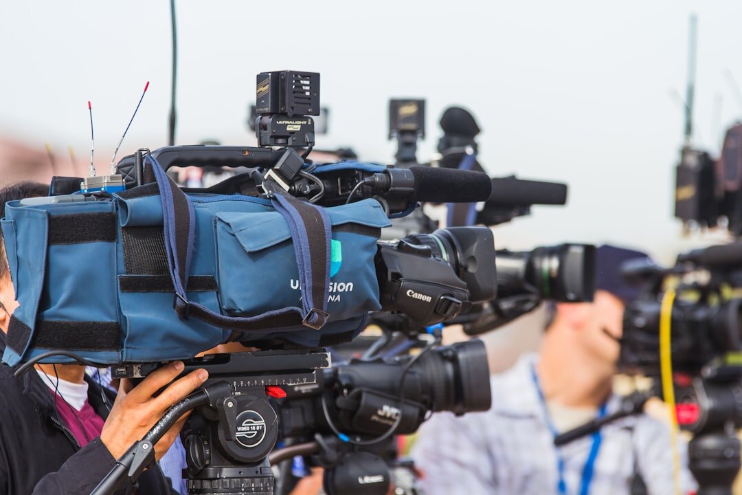 Student presenting news segment to camera